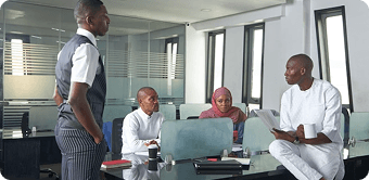 Business professionals in modern office with solar energy solutions